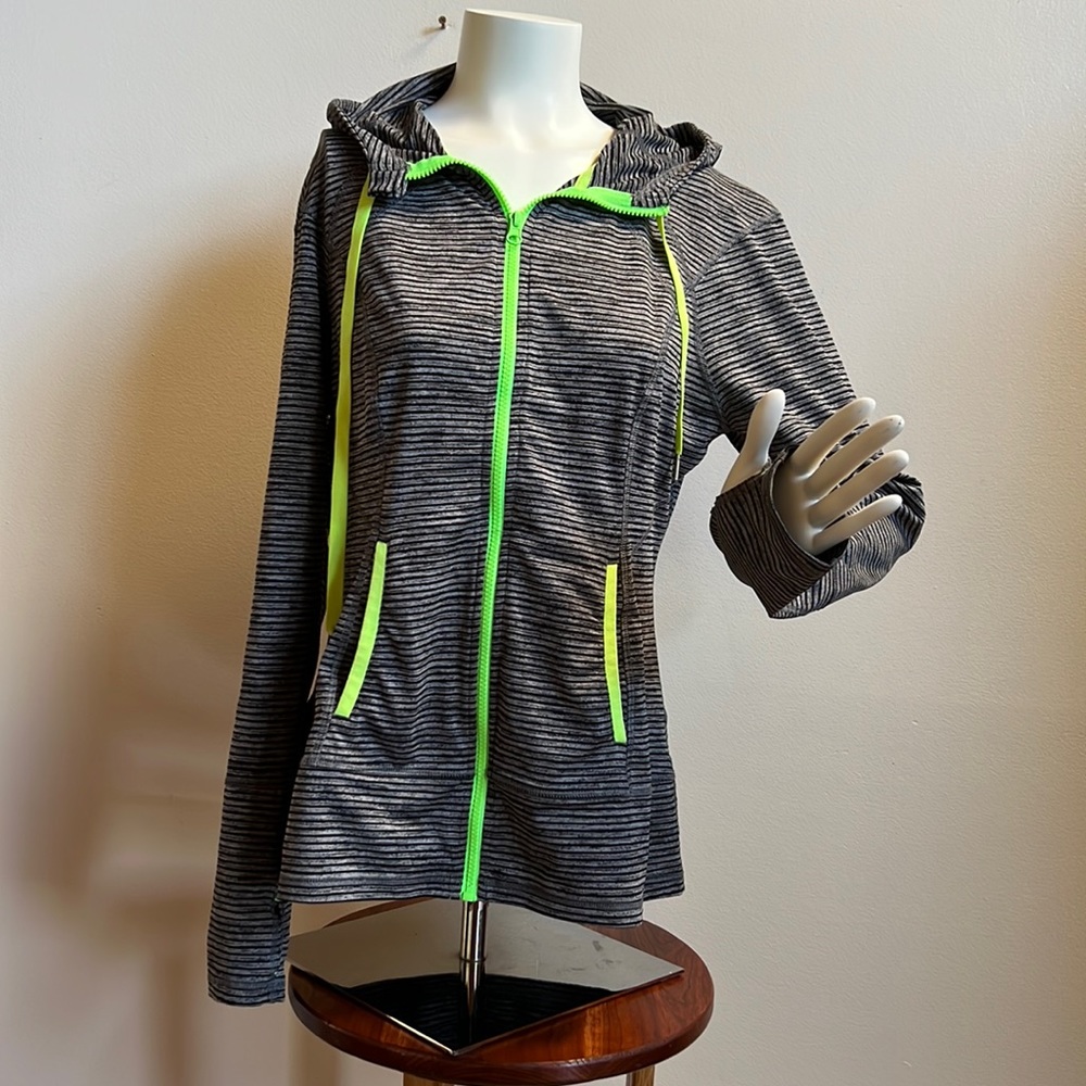 Lukka zip front jacket with neon accents and thumb opening sleeve